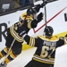 Boston Bruins center Chris Kelly (23) celebrates his game-winning goal against the Washington Capitals with teammate Benoit Pouliot in overtime of Game 1 of an NHL hockey Stanley Cup first-round playoff series in Boston, Thursday, April 12, 2012. The Brui