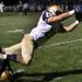 Lemont's Christos Giatras comes up a couple of yards short of the end zone after a long reception against Oak Forest. | Allen Cunningham~For Sun-Times Media