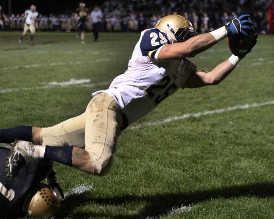 Lemont's Christos Giatras comes up a couple of yards short of the end zone after a long reception against Oak Forest. | Allen Cunningham~For Sun-Times Media