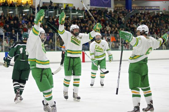 Edina players celebrate a 3rd period goal by Matt Nelson in their victory over Holy Family.  The Hornets broke the game open with a third period scoring binge.  Photo credit - Brian Nelson