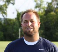 Coach_travis_medium