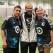 Minneapolis Roosevelt Unified Soccer players pose with their coach at the MNUFC practice facility in St Paul