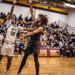 Minneapolis Roosevelt Boys Basketball player goes up for a shot at the season Home opener game