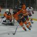Edwardsville defenseman James Akeman controls the puck in his own zone during the second period of Friday's game against Chaminade at the Queeny Park Recreational Complex.