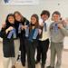 Speech team members with blue ribbons