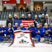 Team USA pose for a photograph on the ice after winning the 2023 Para Hockey Cup.