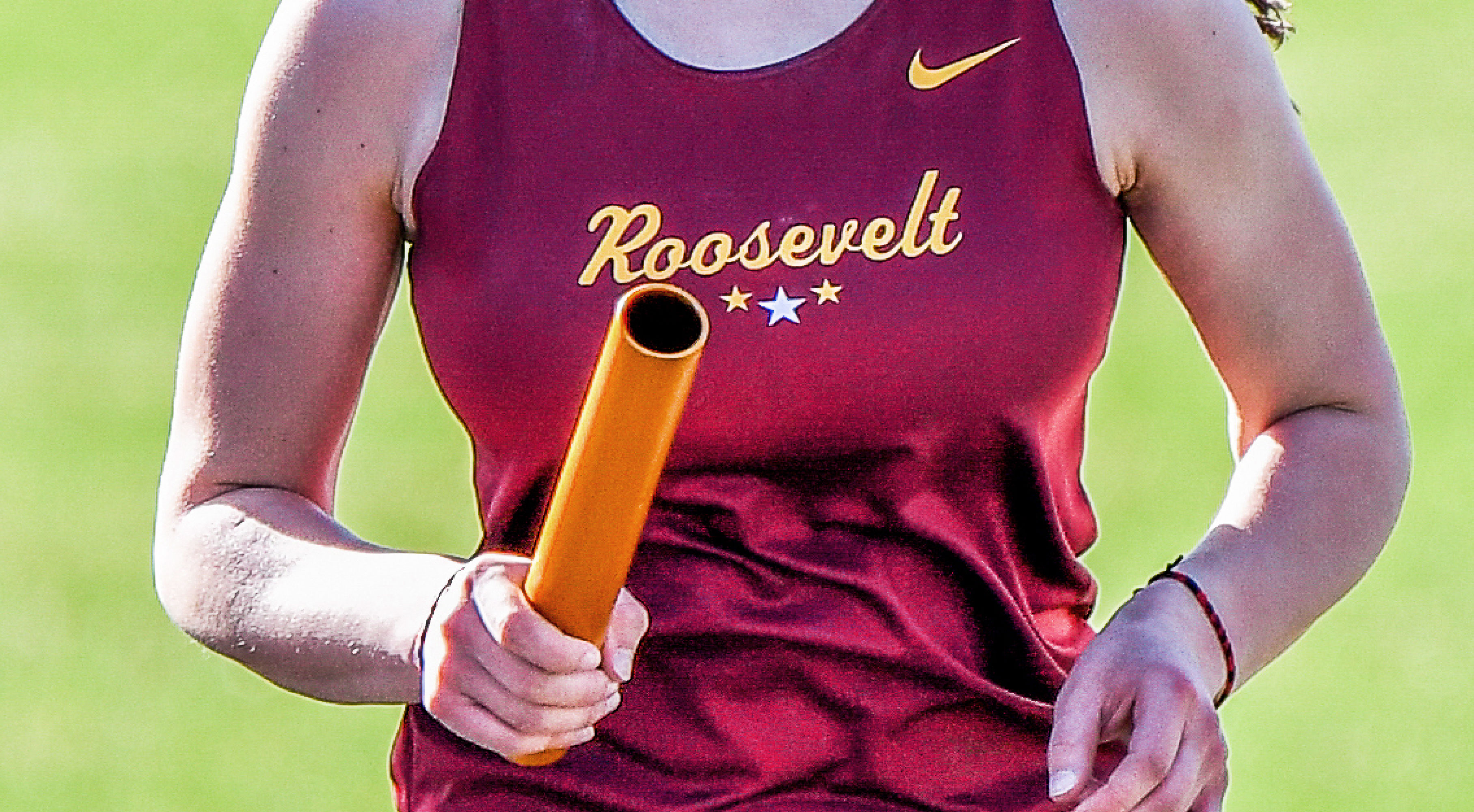 Image of a Minneapolis Roosevelt High School Teddy Track relay runner close up. She holds a gold batton, wears a maroon singlet with script letters: Roosevelt