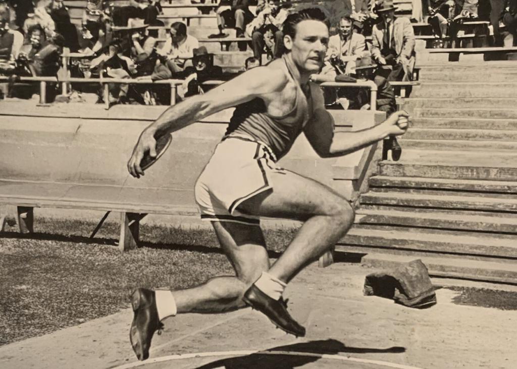 Minneapolis Roosevelt High School Track & Field alumn Fortune Gordien winds up during a Discuss throw during a competition.