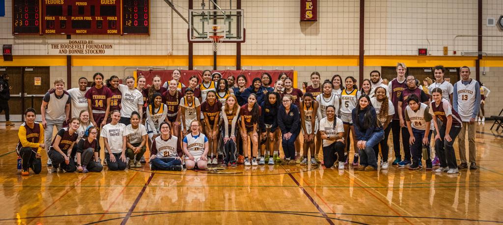 Minneapolis Roosevelt Unified Basketball Halftime event: a big celebration after a made basket.